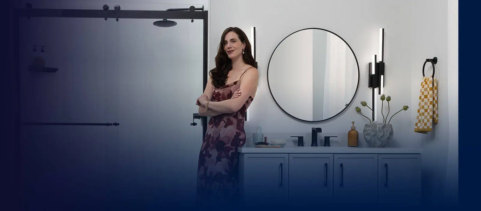 Woman in a bathroom with a Luxury Bath PuroStone shower wall and a black framed glass door