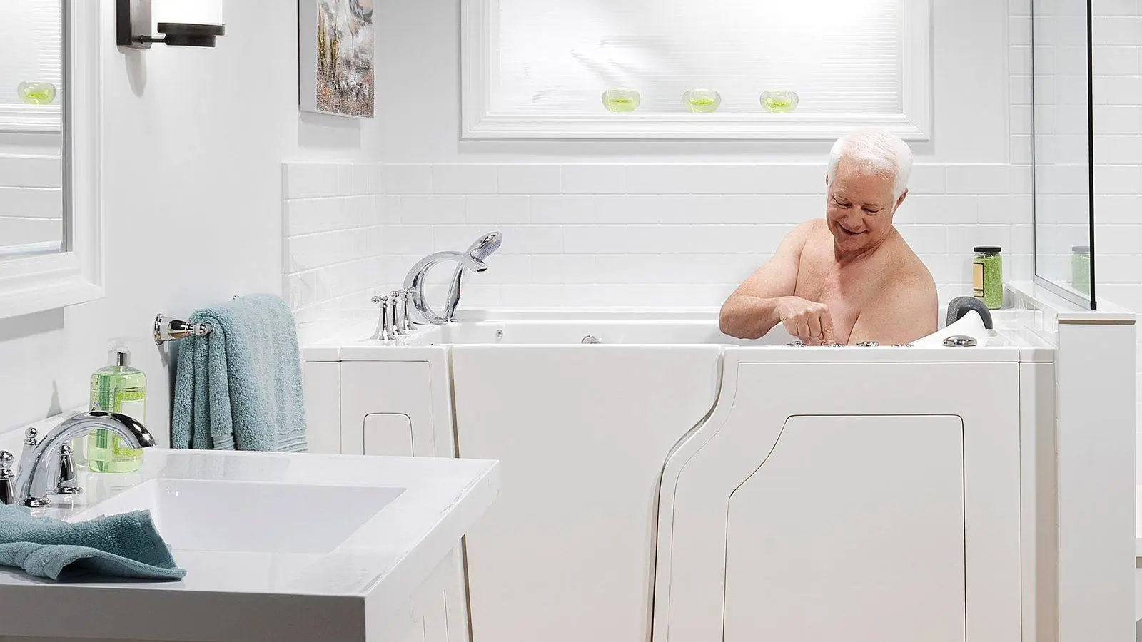 Older man relaxing in a white walk-in tub with a low door and jet controls