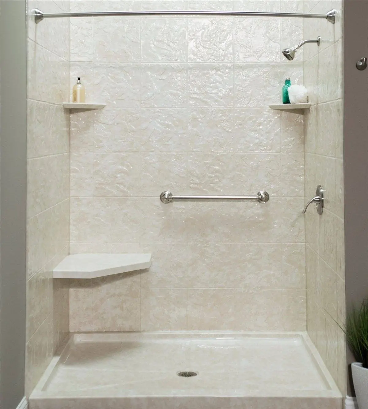 Barrier-free walk-in shower with a built-in seat and grab bars