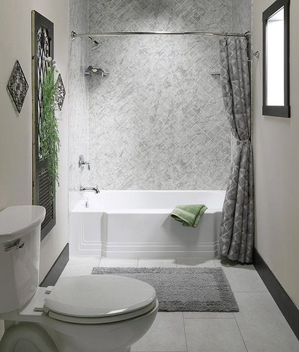 Replacement bathtub with a marble look wall surround and curtain rod
