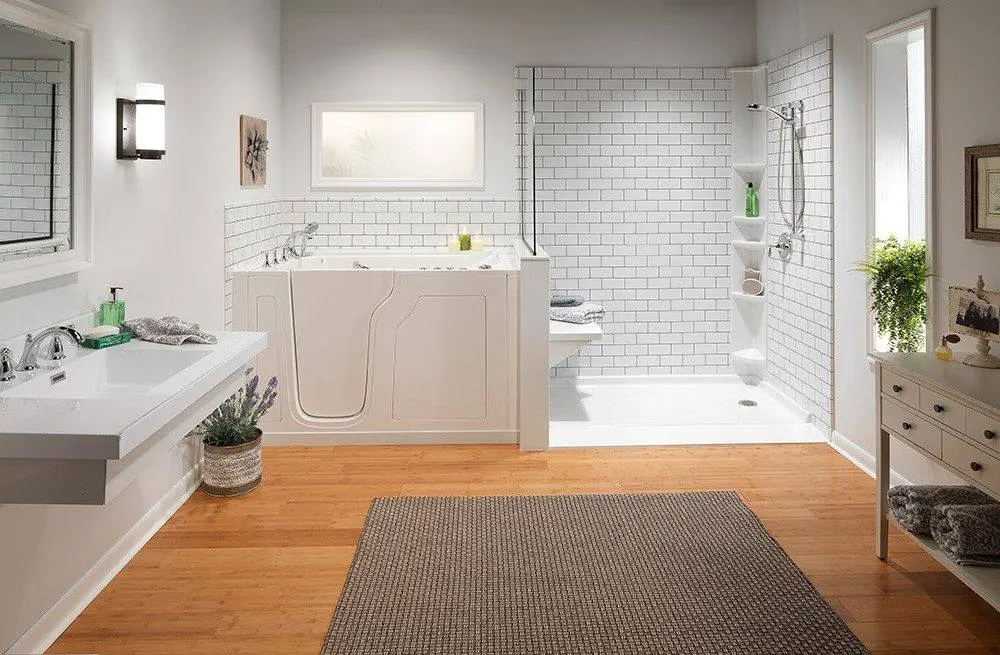 Walk-in tub with a low door beside a white subway tile look walk-in shower with a seat